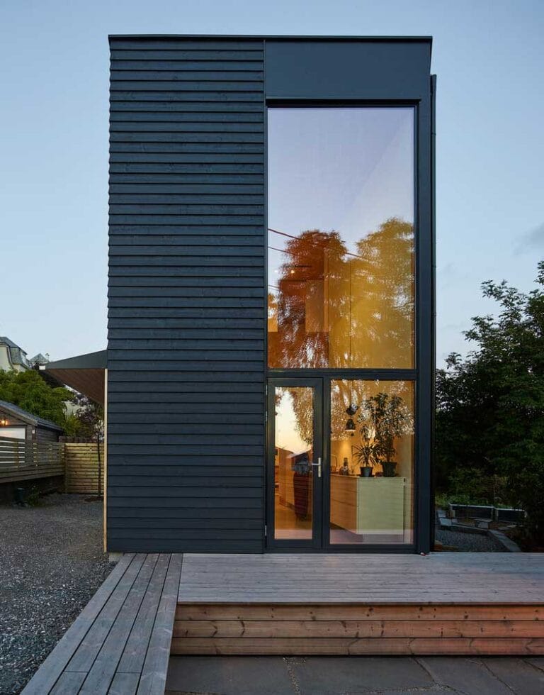 Narrow Two Story House With Modern Wood Trim