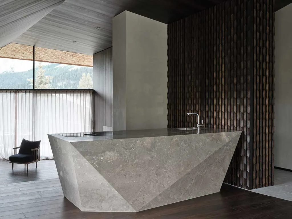 Shingle Shielded Exterior Reveals a Heart of Wood, Stone, and Steel Inside