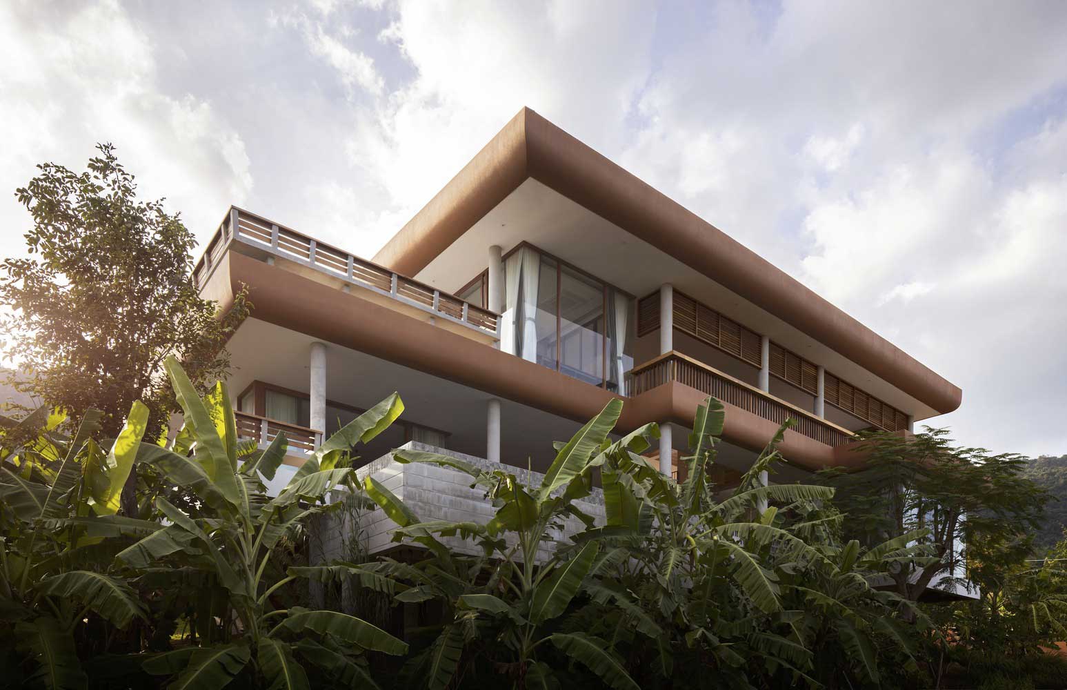 Elevated Pool and Outdoor Kitchen in a Two-Story Platform House