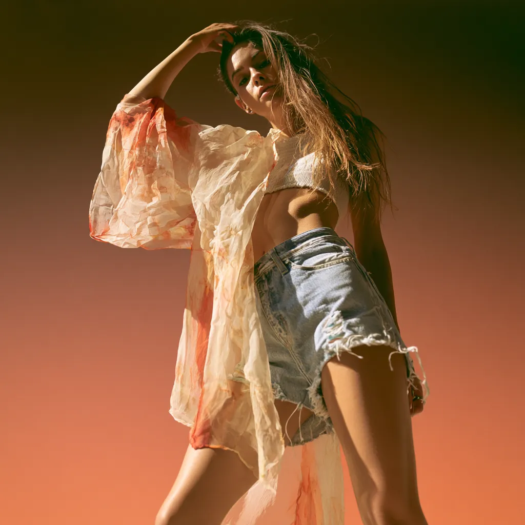 floral sheer kimono over crop top with distressed high-waisted denim shorts desert festival Coachella look