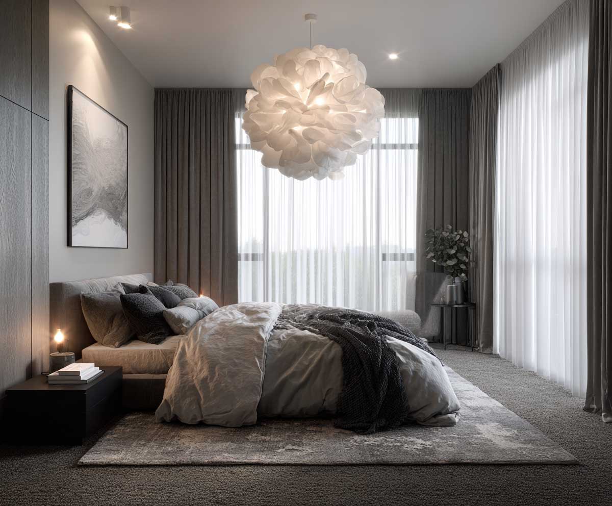 guest bedroom in monochrome gray tones, layered bedding in light and dark grays, sculptural modern pendant light, textured area rug, minimalist decor, soft dramatic lighting, cozy modern interior