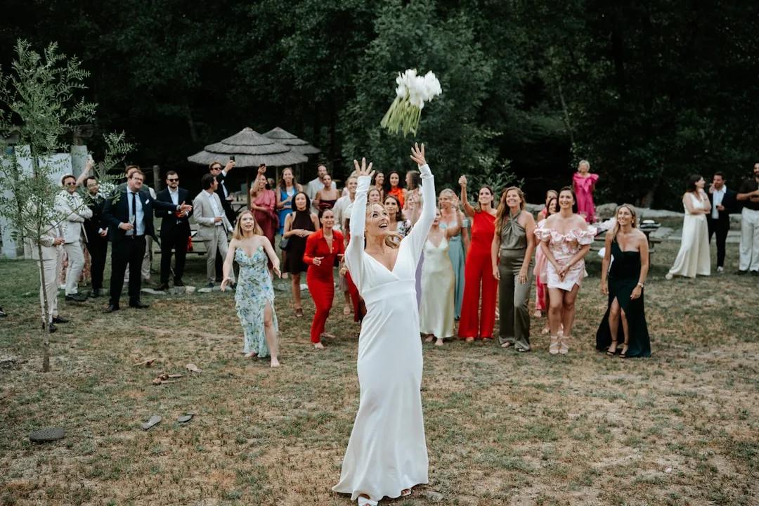 Welcome party guests at candlelit outdoor tables wedding weekend