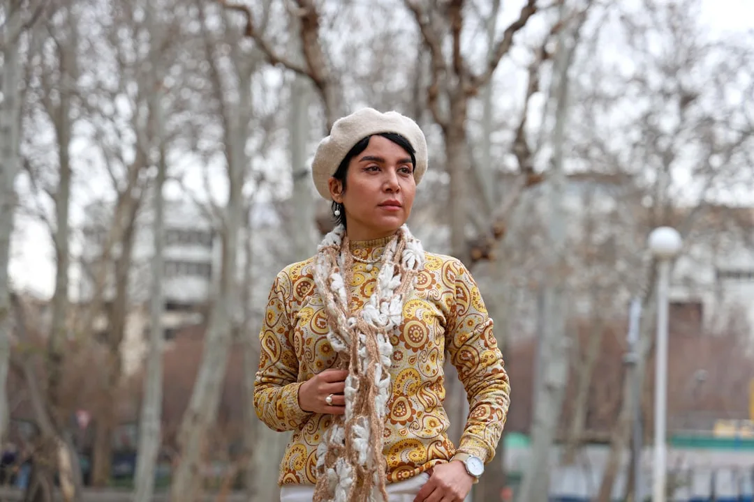 Runway model wearing silk scarf top SS26 collection