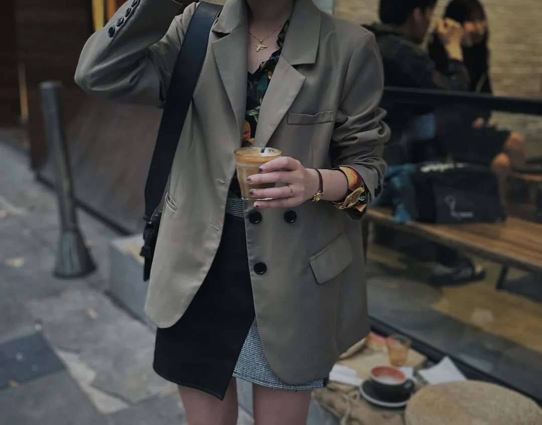 Utilitarian tailoring trend featuring structured blazer with functional cargo pockets and military details