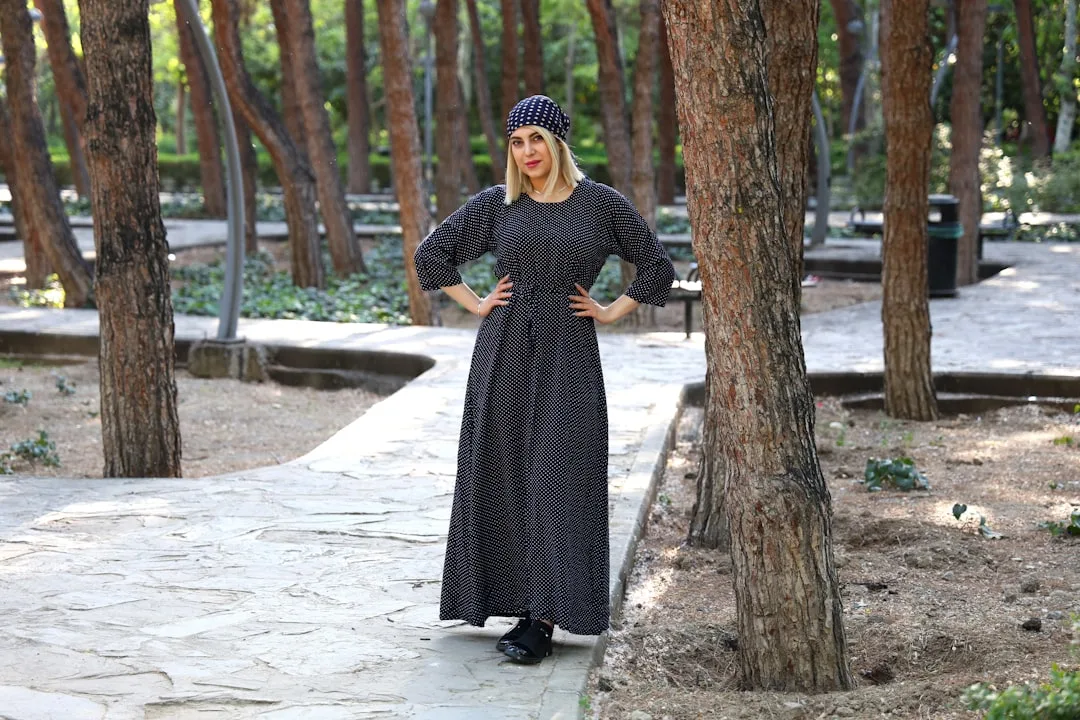 Woman wearing polka dot coat in spring 2026 fashion trend