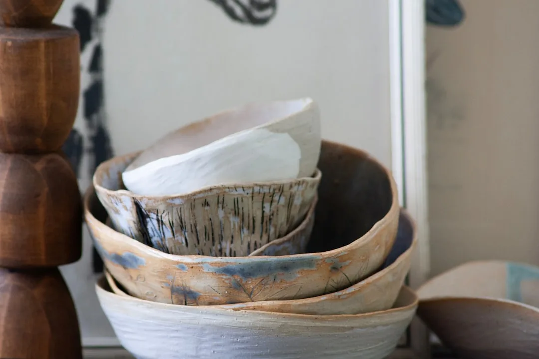 Ceramic sculptural pet feeding bowls on kitchen countertop minimalist interior