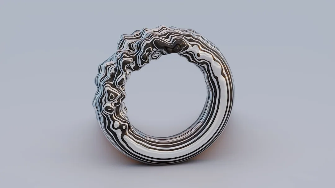 Close-up of 3D printed jewelry showing fine detail and metal finish