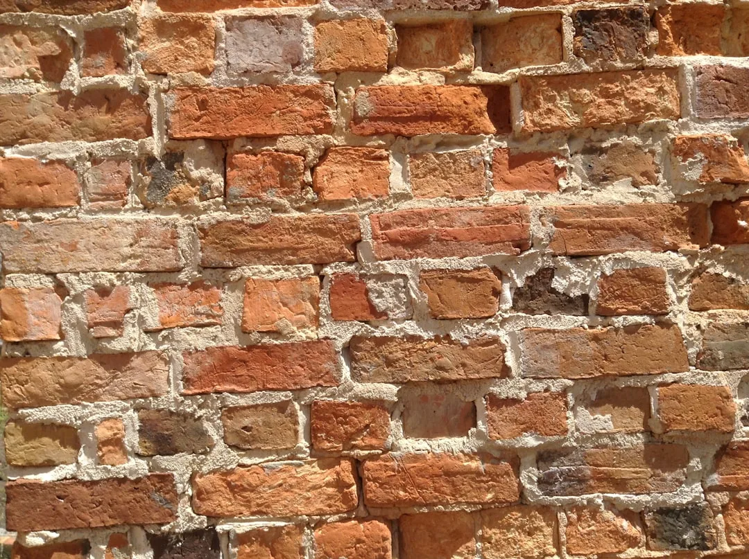 Reclaimed brick materiality with authentic patina texture detail on modern wall surface detail 1