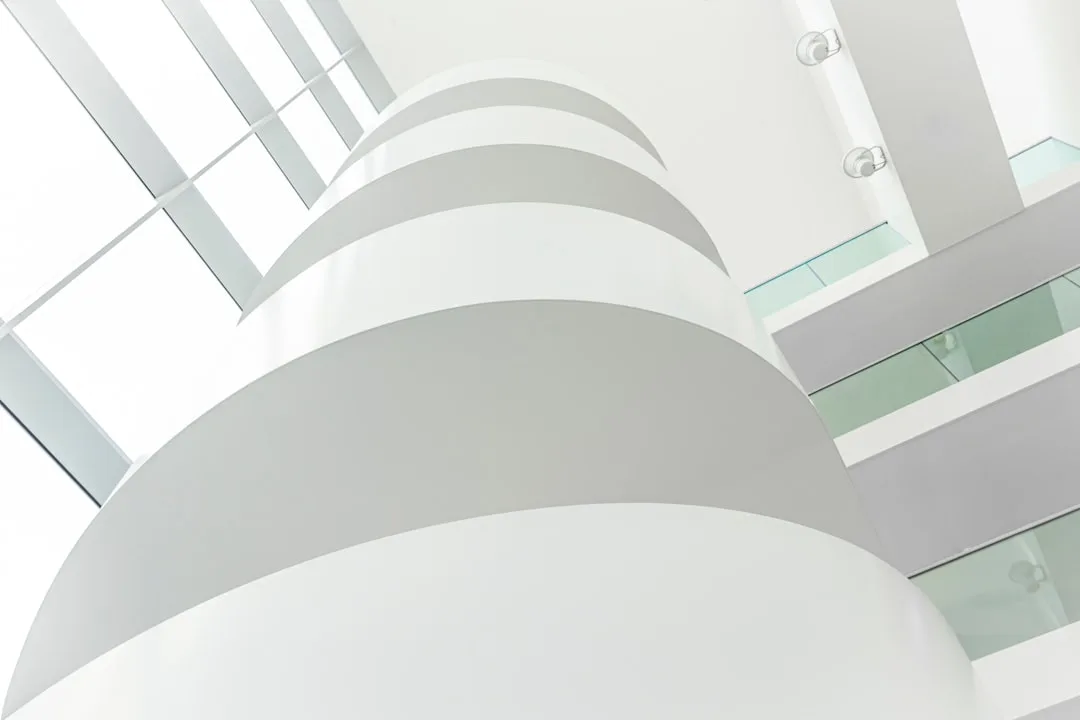 Professional curved drywall installation in residential hallway space