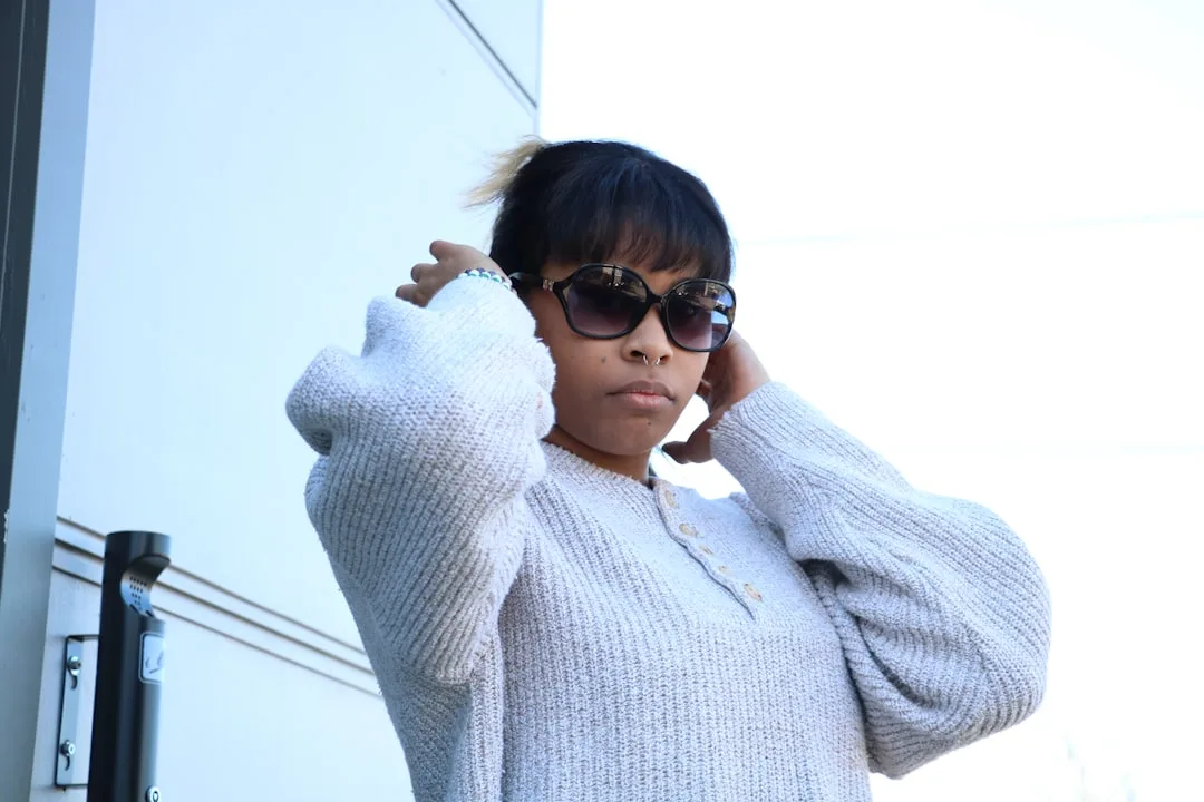 Woman wearing oversized sweater layering with neutral tones and textures