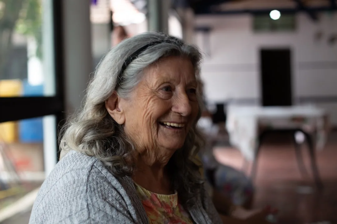 Textured layered hairstyle for older woman with soft dimension detail 1