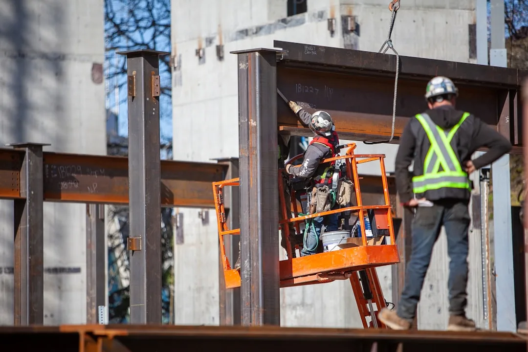 Factory workers assembling modular construction prefabrication wall panels