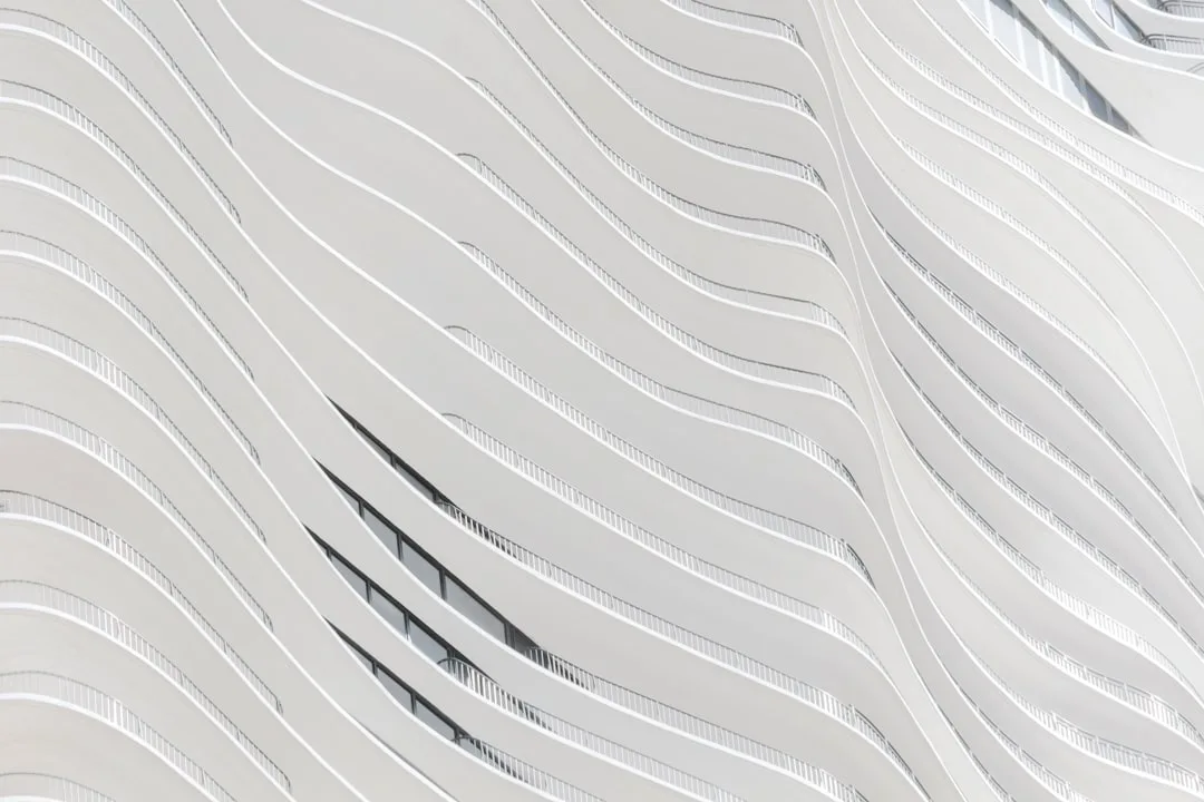 Residential exterior showing layered monochromatic paint blocking technique on contemporary home