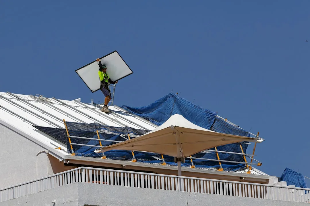 Close-up of interlocking modular roof panel sections with weather sealing