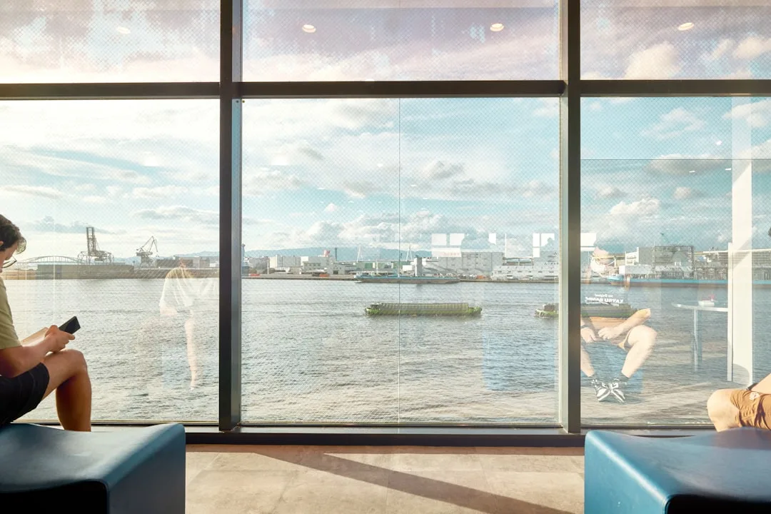Installed smart glass window demonstrating transparent and tinted states side by side