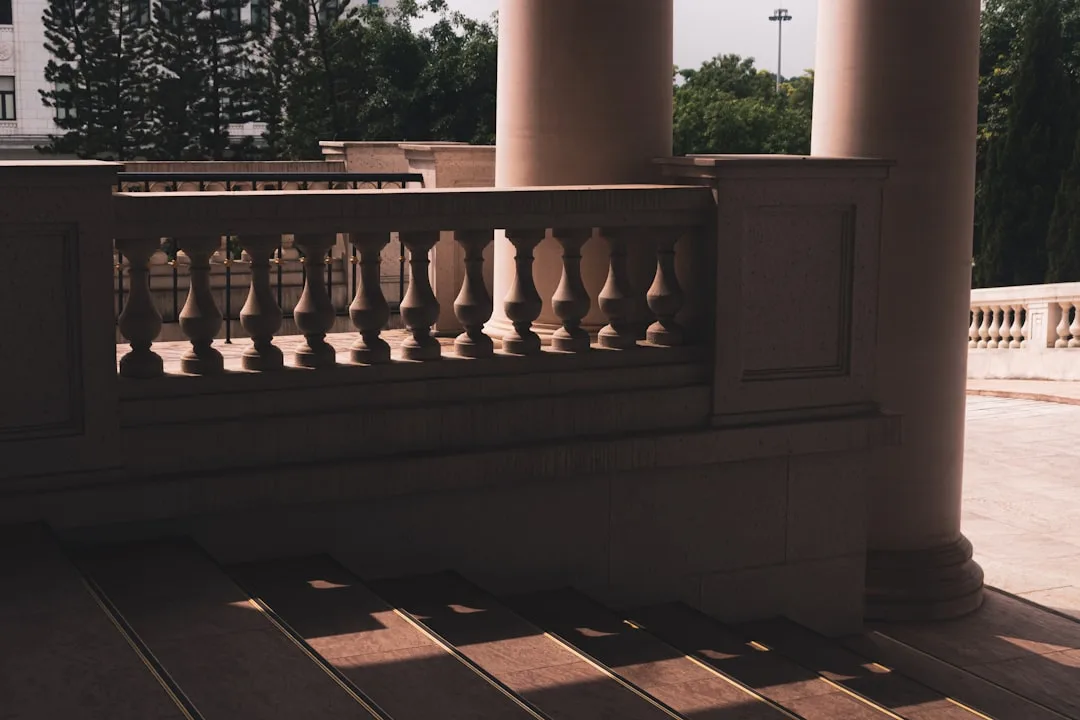 Side-by-side comparison of wood versus composite porch railing materials