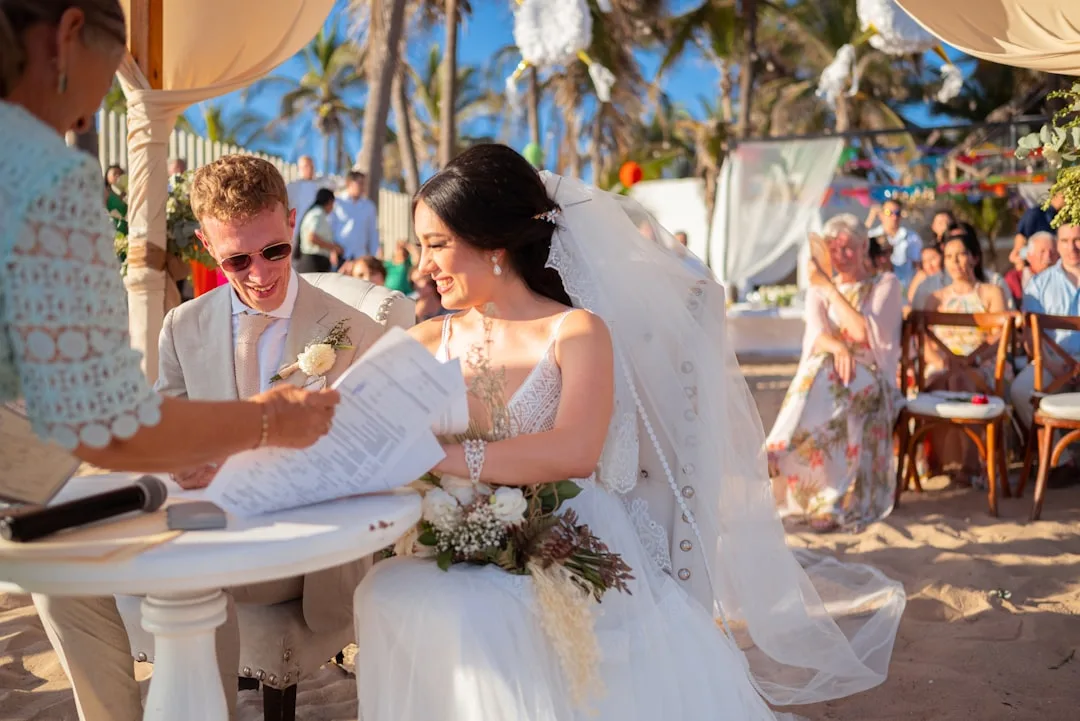Couple exchanging vows at destination wedding events venue overlooking ocean
