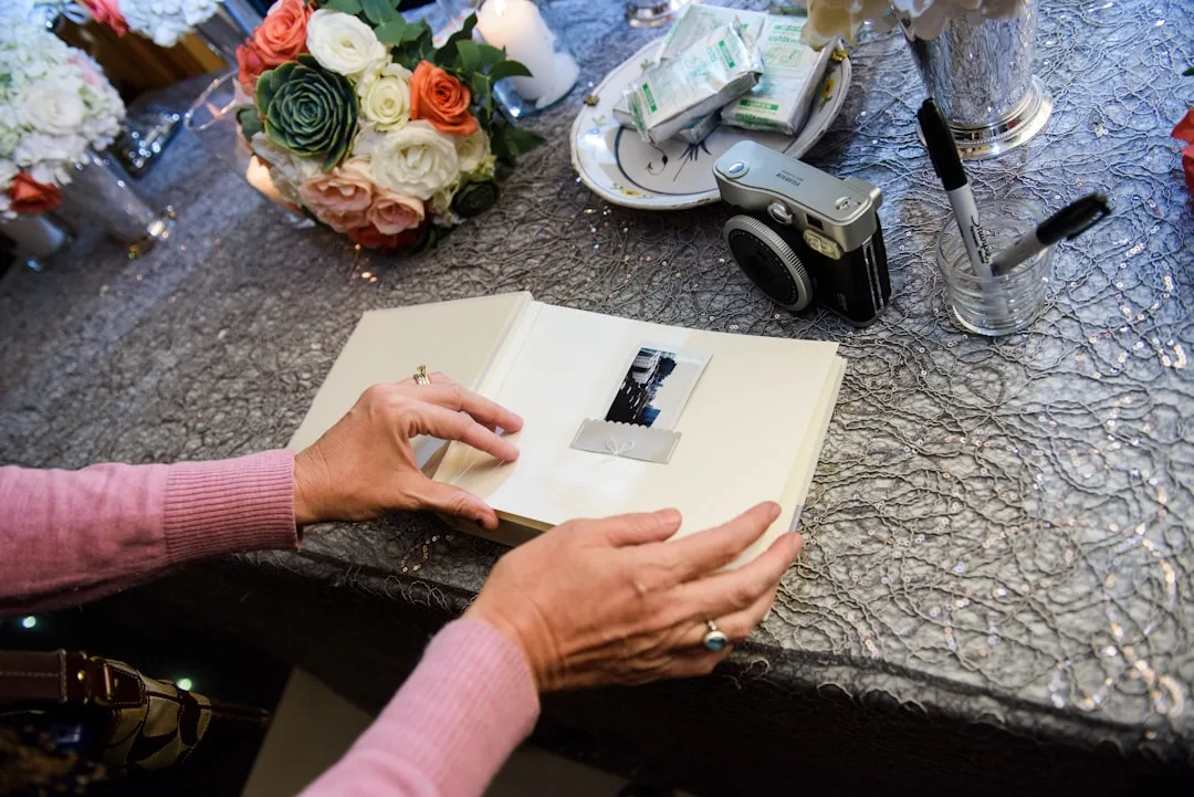 Polaroid guest book wall with handwritten messages and instant photos
