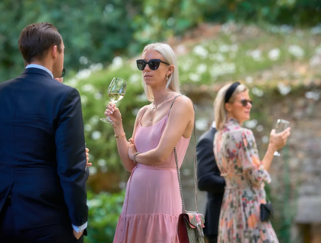 Detail shot of coordinated color palette swatch against luxury wedding guest separates