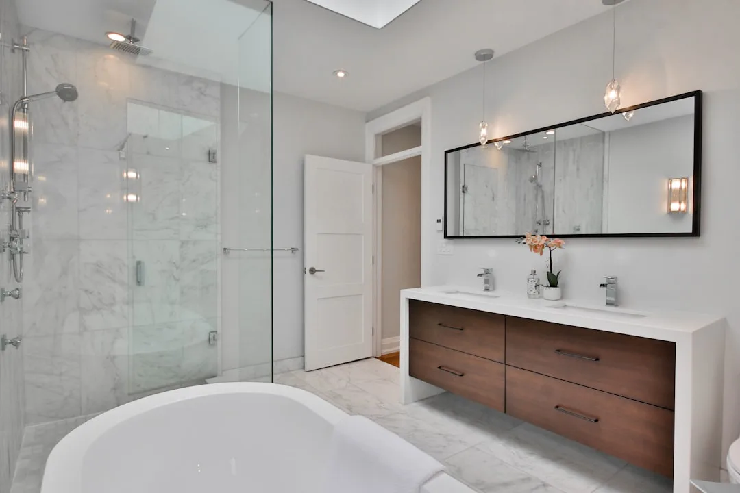 Luxury bathroom with radiant heated flooring system installed beneath marble tile