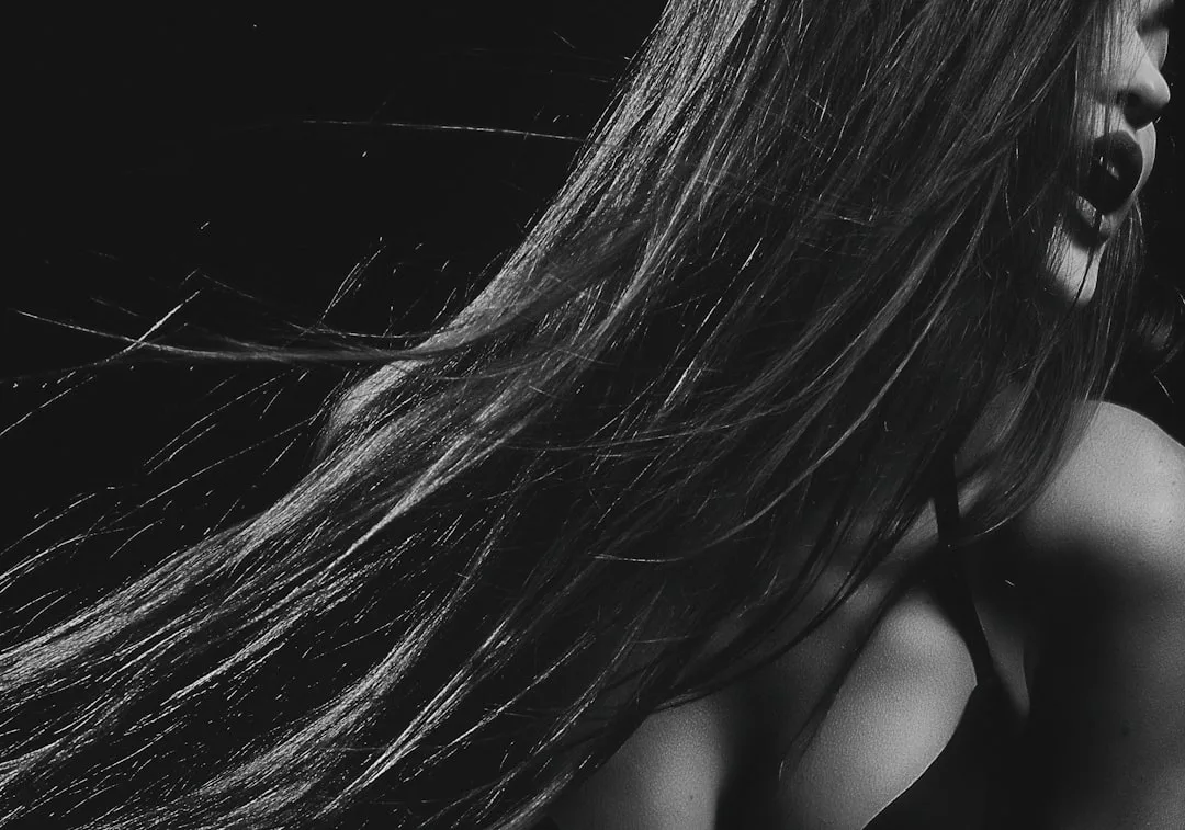 Woman with sleek straight hair trend glossy finish 2026 detail 4