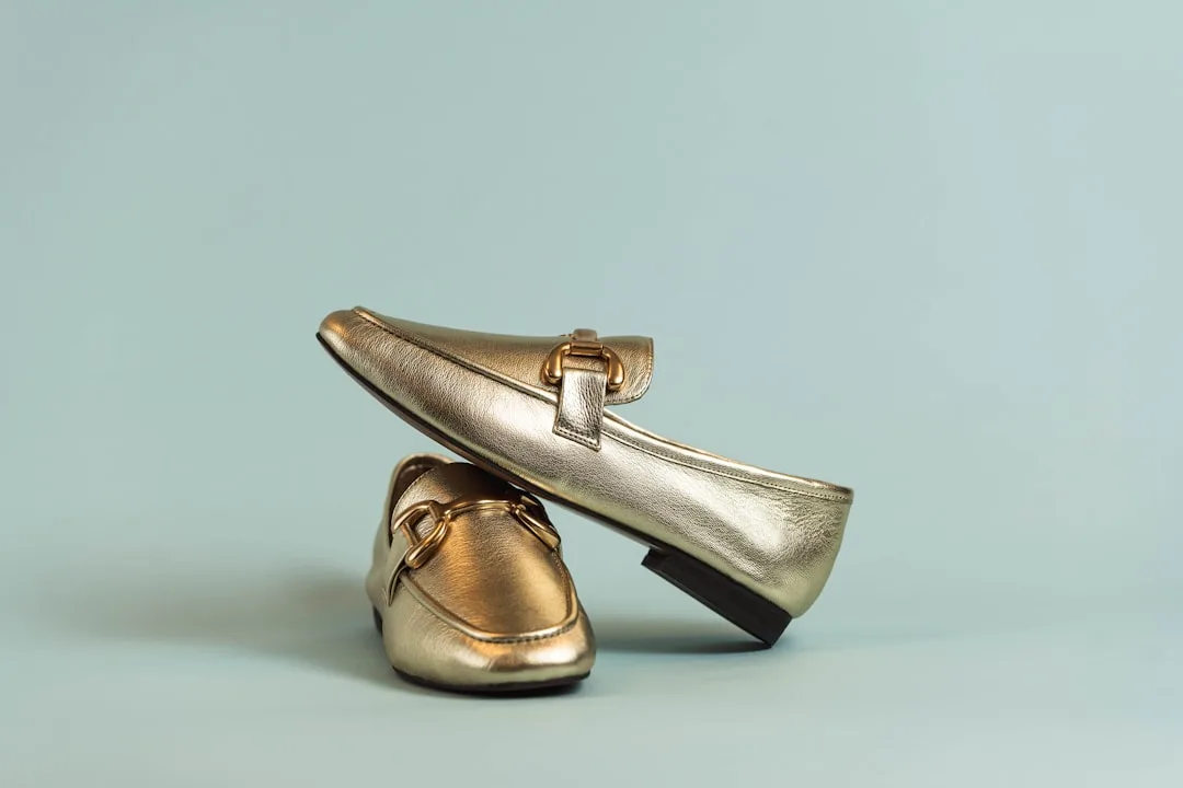 Close-up of silver metallic ballet flat showing liquid metal finish detail