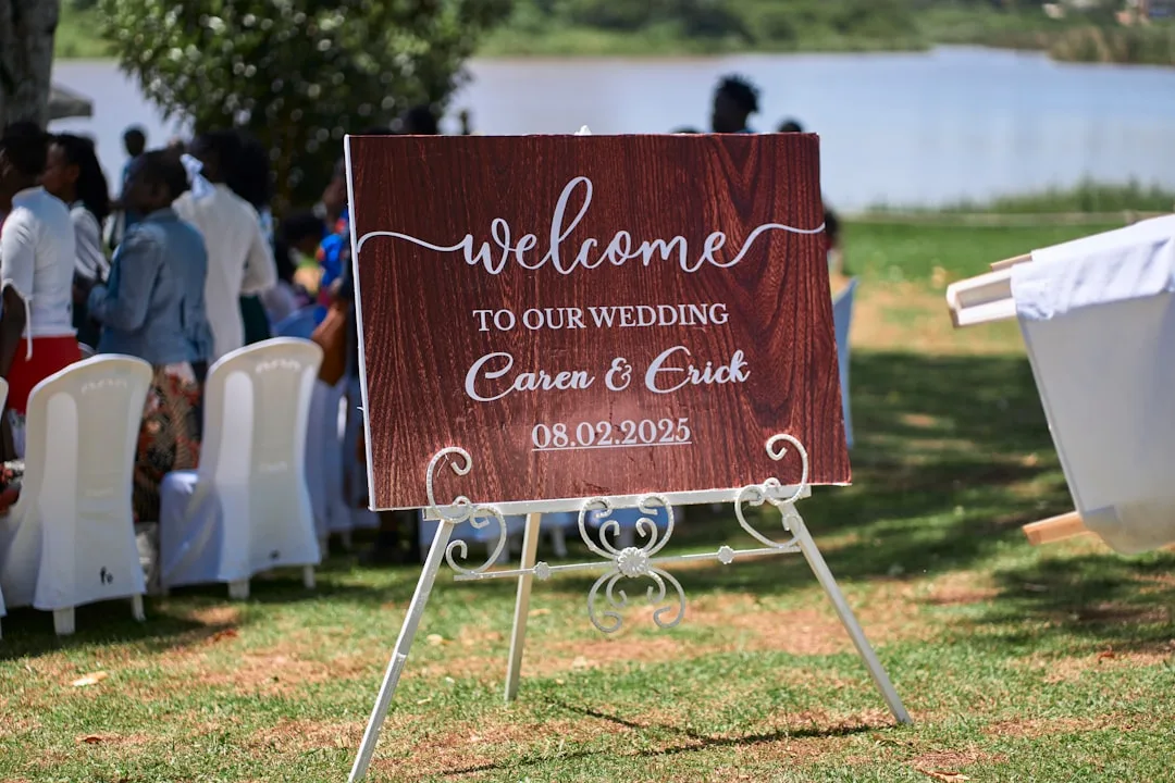 Personalized wooden wedding welcome sign with calligraphy at outdoor ceremony entrance detail 4