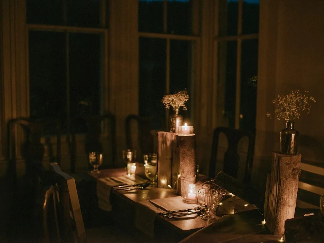 Intimate celebration events with candlelit table and curated guest list detail 3