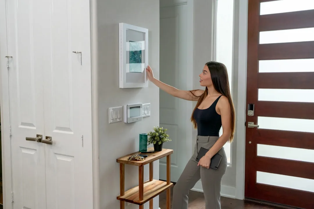Modern ambient smart display integrated into minimalist living room wall detail 4