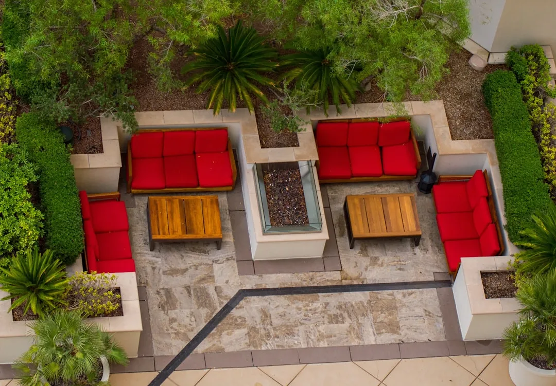 Family rearranging modular seating components for outdoor entertaining