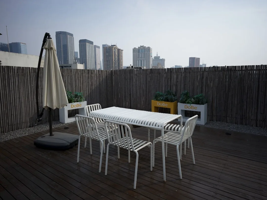 Composite slatted privacy screen installation showing ventilation gaps between horizontal boards