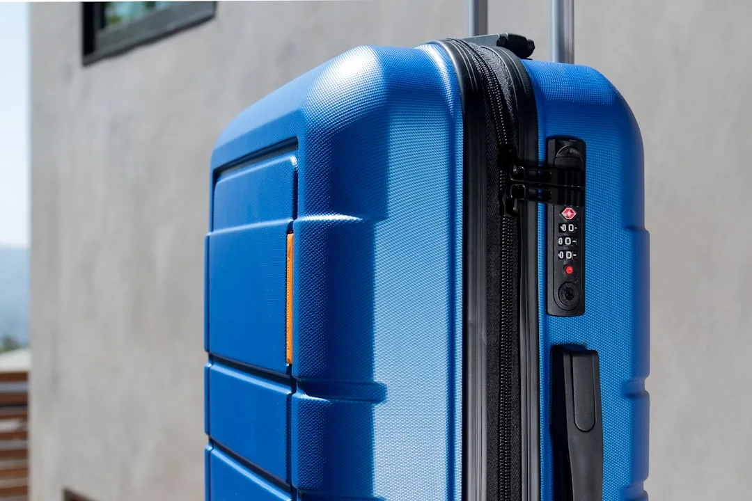 Modern digital luggage tag with e-ink display on premium travel suitcase detail 3