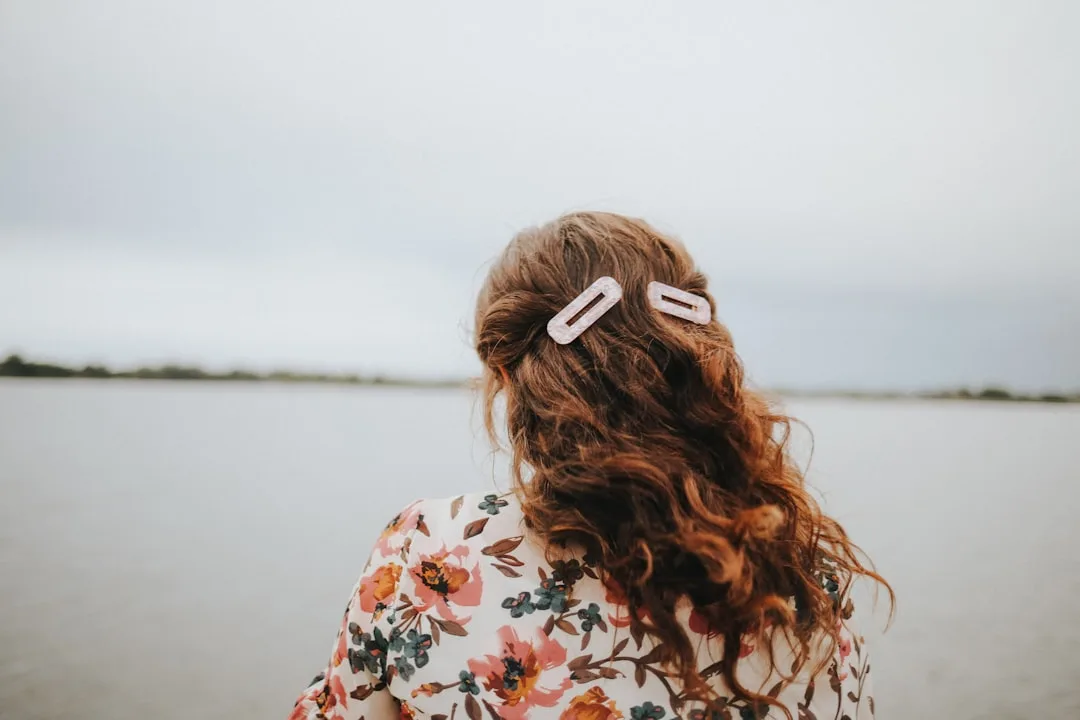 Back view of long layered hair styled with oversized tortoiseshell hair claw