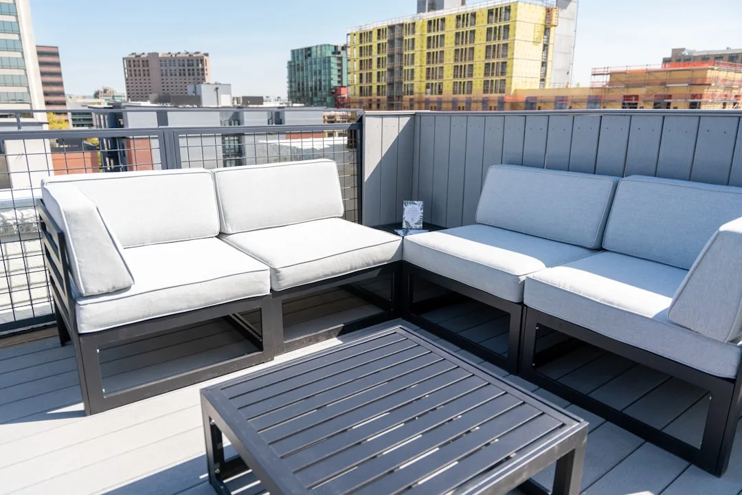 Performance outdoor furniture fabrics in neutral tones on modern patio seating detail 4