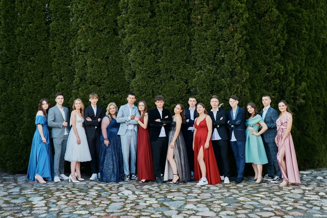 Modern wedding rehearsal dinner dress with coordinated silk separates and bold jewelry detail 4