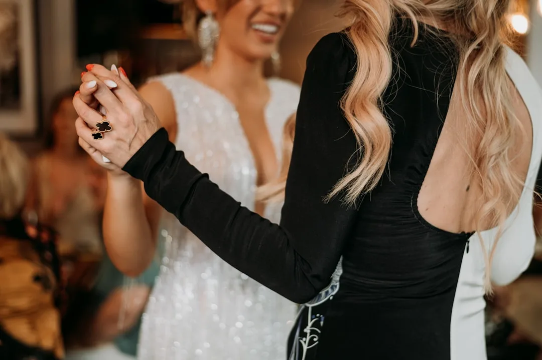 Coordinated rehearsal dinner separates with metallic accents and minimalist styling