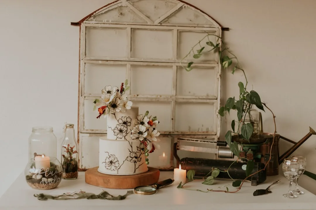 Marble-effect wedding cake with asymmetrical tiers and gold leaf accents