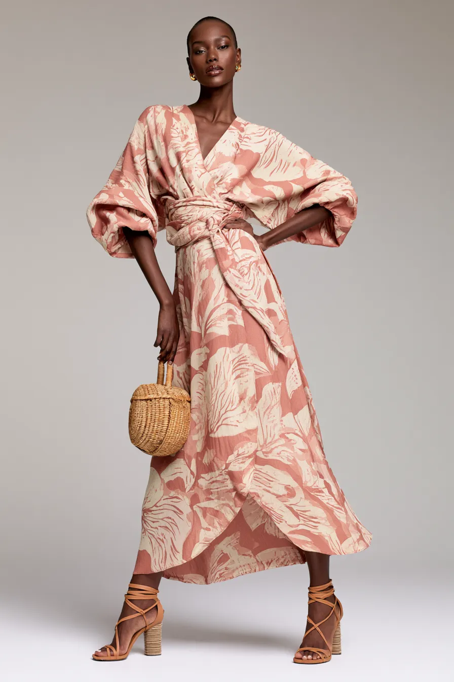 Best casual wedding guest outfit for women featuring a wrap midi dress and block heels