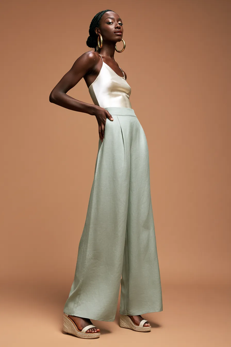 Sage green linen co-ord — casual wedding guest outfit idea for women at a garden venue