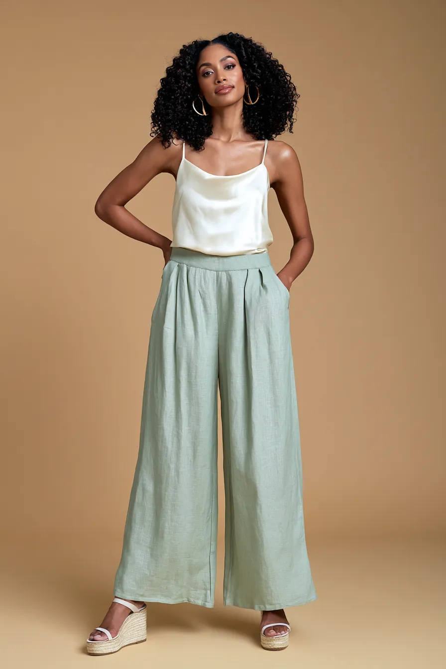 Women's casual wedding guest outfit in sage linen separates and espadrille wedges