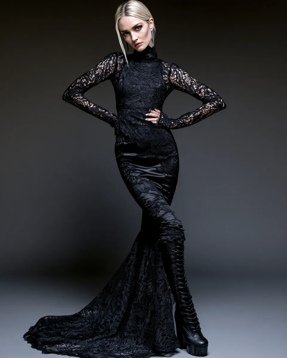 Editorial studio shoot of a model in a chic gothic black outfit built around lace and satin, full body shot with atmospheric dark backdrop and sharp lighting.