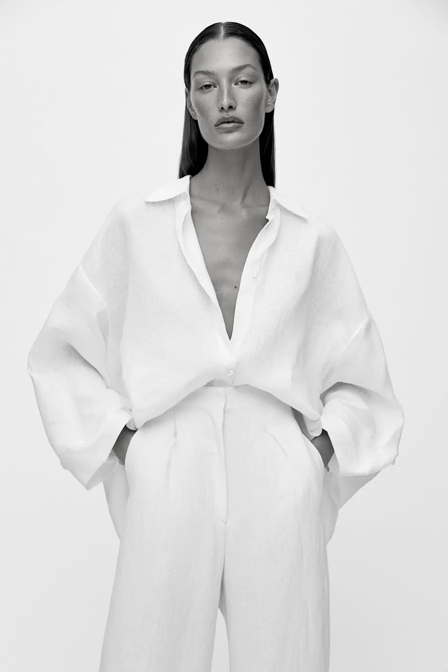 Clean minimalist fashion look featuring neutral palette and simple straight hair