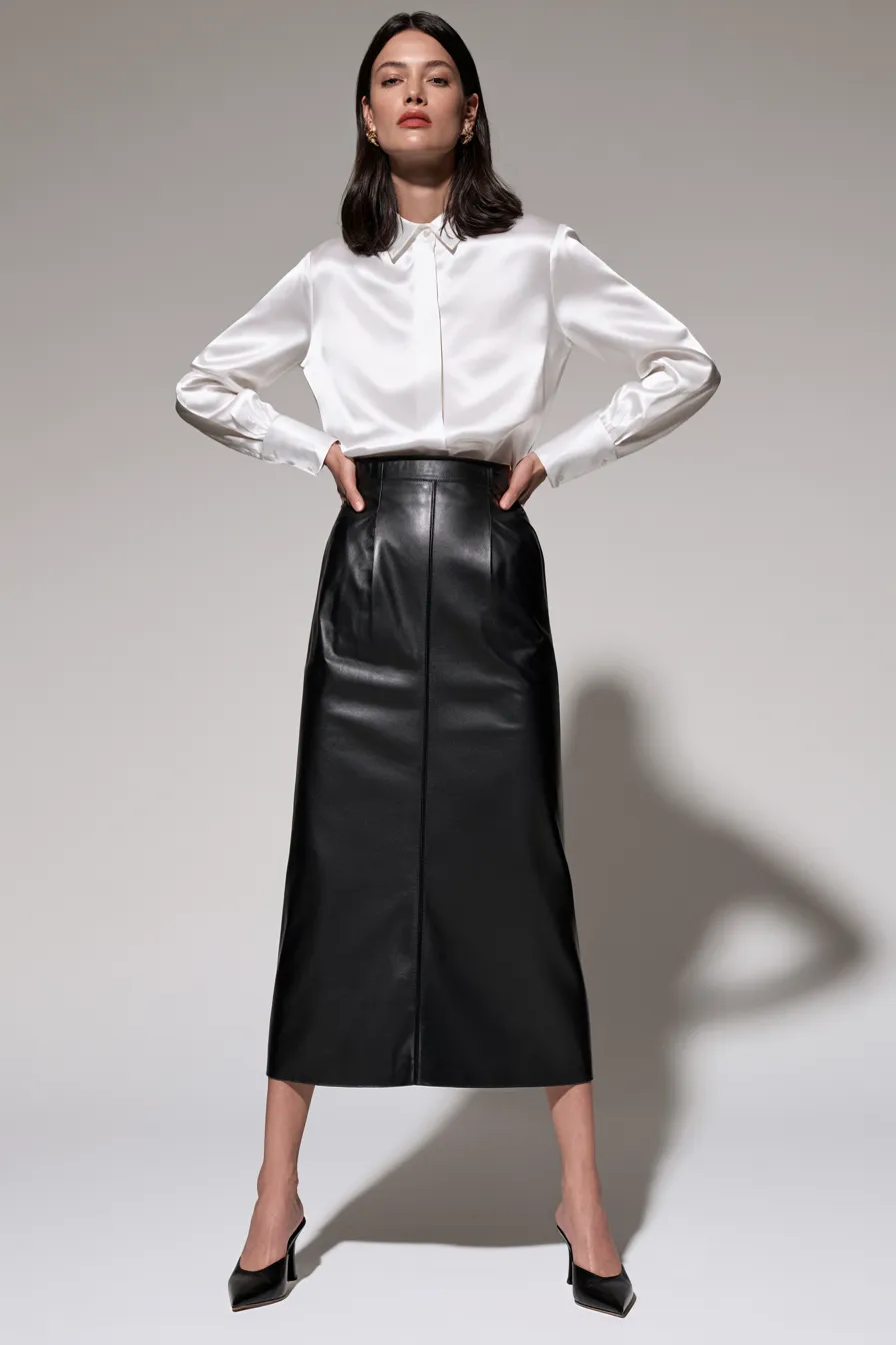 Minimalist black leather skirt outfit idea with white blouse and kitten-heel mules