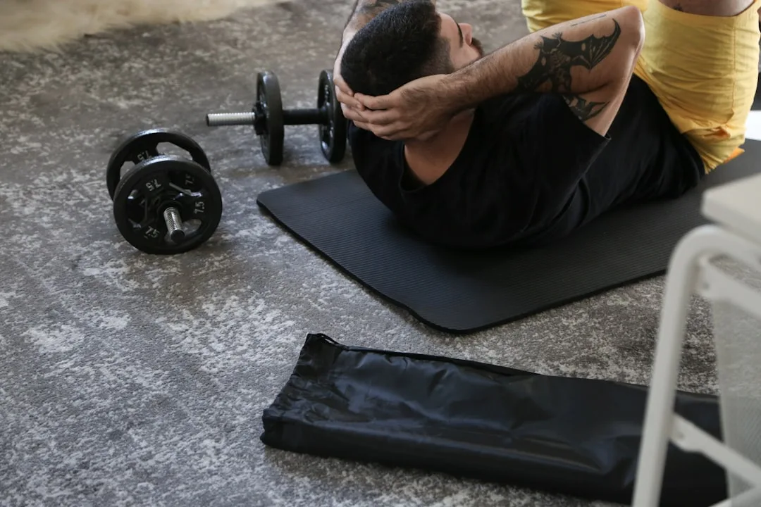 Man performing single-leg squat bodyweight strength progression indoors