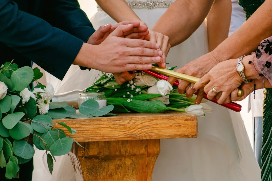 couple performing handfasting unity ritual — perspective 2