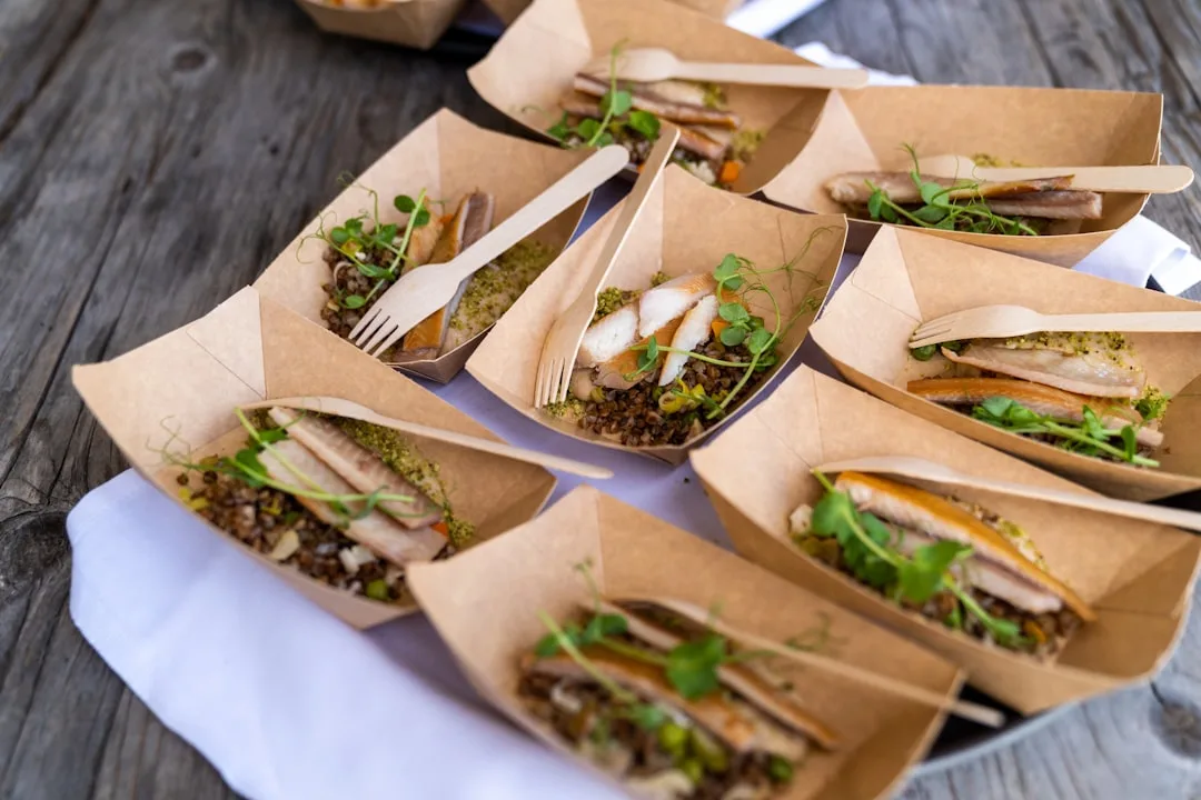 Eco-friendly event catering with reusable dinnerware and local sourcing displayed detail 1
