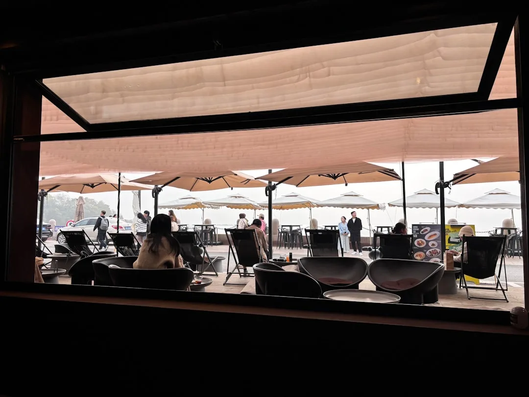 Modular aluminum shade structure with adjustable louvers in residential backyard