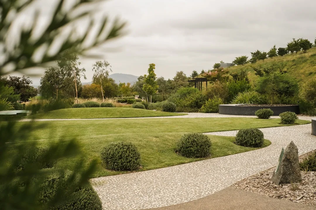 Gravel garden pathways transform compact landscapes without poured concrete