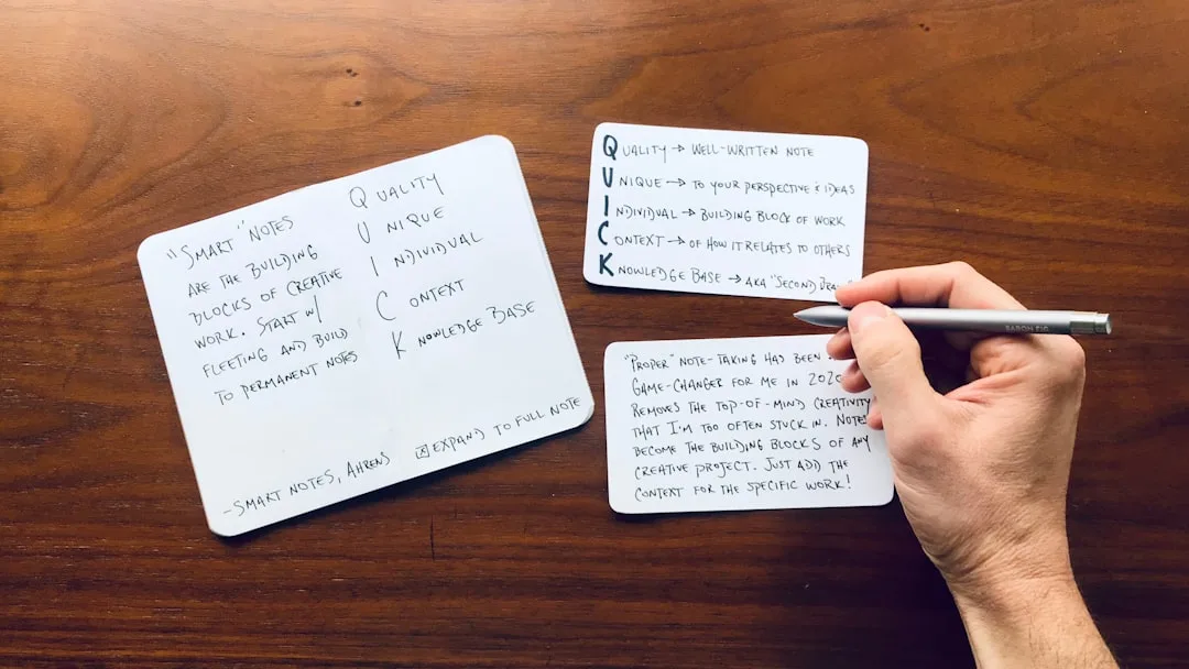 Professional using spaced repetition learning software on desktop with flashcards