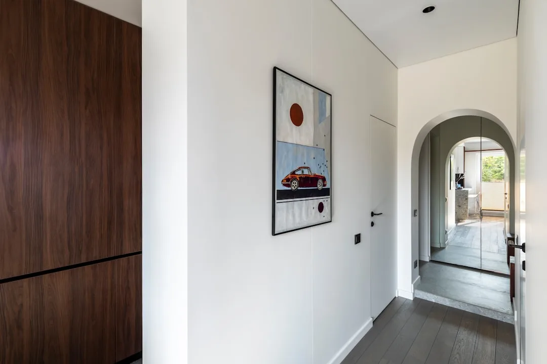 Arched doorway entrance showing soft transition between bedroom hallway zones